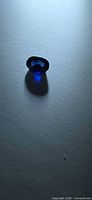 Top view of single oval sapphire showing royal blue color
