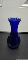 Full front view of cobalt blue cut glass vase