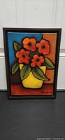 Front view of framed acrylic floral painting