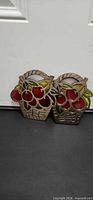 Pair of fruit basket trivets front view showing painted accents