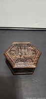 Top view showing carved hexagonal wooden trinket box lid design