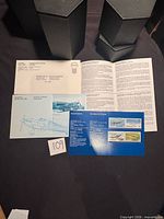 Front view showing mounting card with four Canadian Military Aircraft stamps, leaflet, and outer envelope