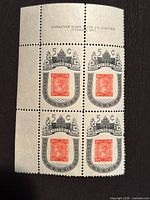 Front view of the four-stamp plate inscription block with selvedge