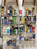 Full view of all shelves with assorted aerosols, jugs, cans