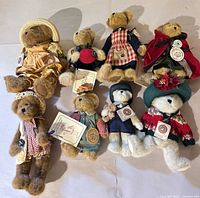 Eight Boyds Bears displayed together showing assorted outfits and tags