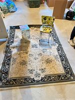 Full view of rug with table and chair placed on top