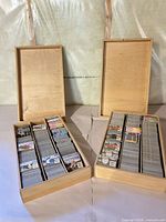 Two open wooden boxes filled with Ty Beanie Babies trading cards