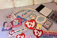 Group view of promotional signs, CD case, binder, guide booklet