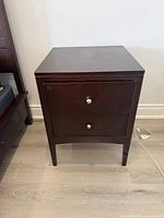 front angled view of nightstand showing overall design and finish