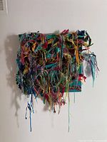 Front view of the mixed media artwork showing overall composition and colours