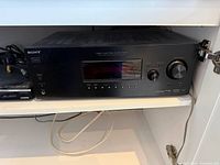 Front view of Sony receiver inside cabinet