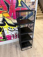 Front angled view of full shelf showing wire frame and four wood shelves