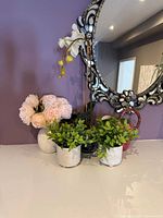 Group view of all five decorative pieces on countertop