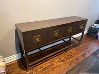 Front angled view of purple sideboard showing four doors and lower shelf