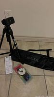 Tripod assembled with bag, manual and Kalt air release displayed