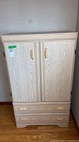 Front view of highboy wardrobe dresser, doors closed