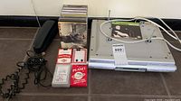 All items grouped: Sony radio, CDs, card decks, telephone