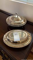 Both silverplate covered serving dishes together