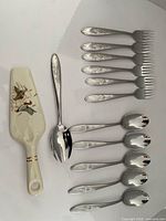 Complete lot layout showing flatware and pie server