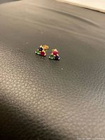 Front view of both earrings showing gemstones