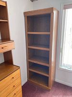 Front view of first Sauder bookcase with five shelves