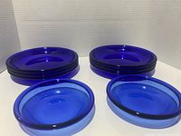 Stack and pair of cobalt blue plates