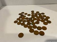 Group view of scattered 1967 Canadian pennies