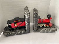 Front view of both bookends showing locomotive and caboose details