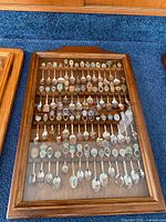 Full view of closed display case holding entire spoon collection