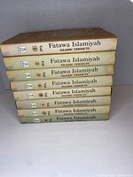 Spines of all eight volumes showing uniform titling and numbering