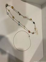 Both necklaces laid out in box