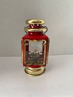 Front view of red and gold lantern