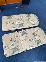 Two patterned chair cushions front view
