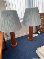 Front view of both teak lamps with shades