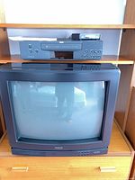 Front view of RCA ColorTrak TV with RCA VCR and accessories