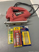 Front view of Skil 4290 jigsaw with three blade packs