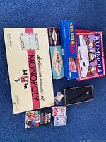 Overview of all boxed games and accessories on blue carpet