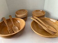 Overall view showing two large bowls, six small bowls and four utensils