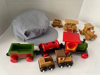 Overview showing hat, painted train cars, natural finish vehicles