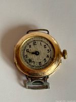 Front view showing dial, missing crystal and hands