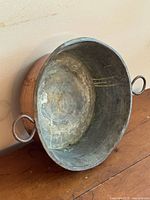 Top view showing full interior tin lining, wear, loop handles