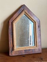 Front view of pine wall mirror showing full frame and glass