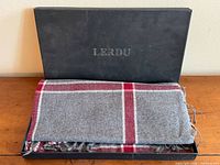 Scarf folded inside black Lerdu box