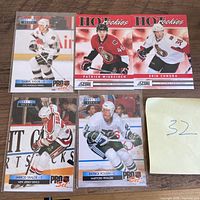 Five NHL rookie cards arranged on table
