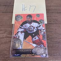 Front view of Dominik Hasek Fleer Metal Universe card in sleeve