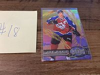 Front view of Joe Sakic 1996-97 Fleer Metal Universe hockey card