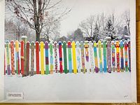 Front view of Edward Kolano photograph showing full image of multicolored fence in snow