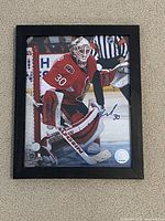 Full view of framed signed photograph