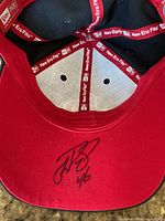 underside of brim with Patrick Wiercioch signature and New Era interior taping