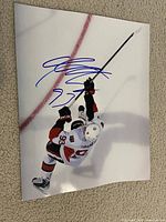 Front view of signed 8x10 Mika Zibanejad photo